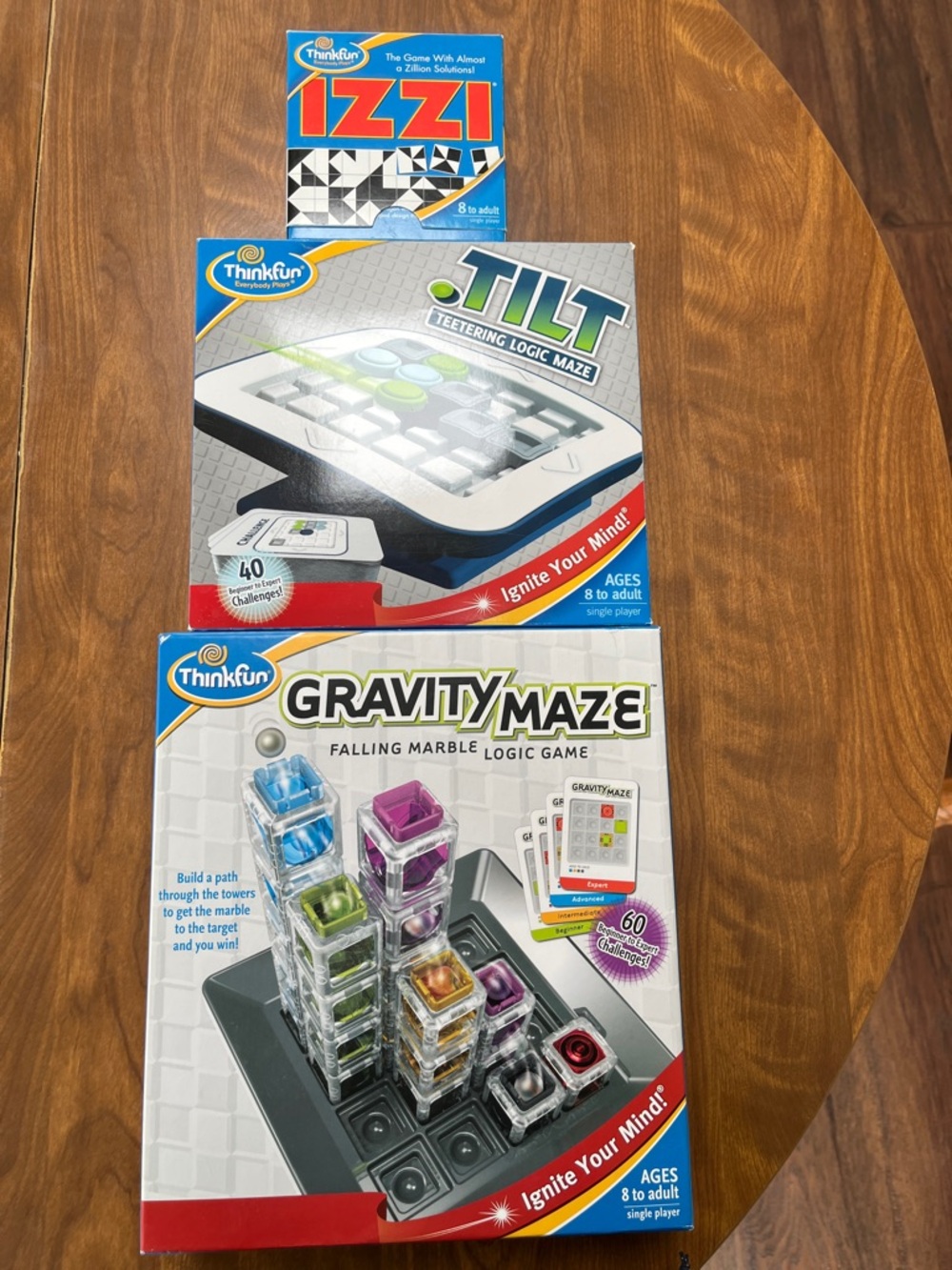 ThinkFun Gravity Maze Marble Logic Game Tilt Teetering Logic Game, and Izzi